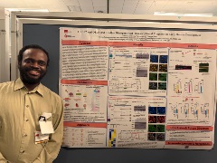 HPTM Student Emmanuel Nyong smiling at the camera during his poster presentation at the 2025 GSBS Research expo